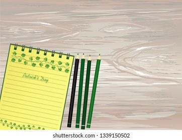 Notebook with template hand-drawn Green festive bunting with clover and pencil. Irish holiday - Happy St. Patrick's Day with a garland of three-leaf. Vector on wooden background
