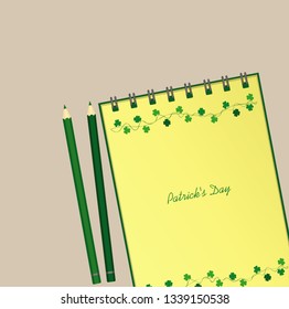 Notebook with template hand-drawn Green festive bunting with clover and pencil. Irish holiday - Happy St. Patrick's Day with a garland of three-leaf. Vector. A realistic notepad. Office stationery.