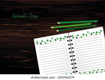 Notebook with template hand-drawn Green festive bunting with clover and pencil. Irish holiday - Happy St. Patrick's Day with a garland of three-leaf. Greeting card on holiday. Vector on wooden back