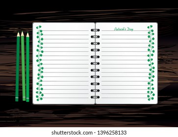 Notebook with template hand-drawn Green festive bunting with clover and pencil. Irish holiday - Happy St. Patrick's Day with a garland of three-leaf. Greeting card on holiday. Vector on wooden back