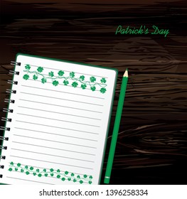 Notebook with template hand-drawn Green festive bunting with clover and pencil. Irish holiday - Happy St. Patrick's Day with a garland of three-leaf. Greeting card on holiday. Vector on wooden back