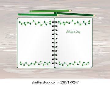 Notebook with template hand-drawn Green festive bunting with clover and pencil. Irish holiday - Happy St. Patrick's Day with a garland of three-leaf. Greeting card on holiday. Vector on wooden back