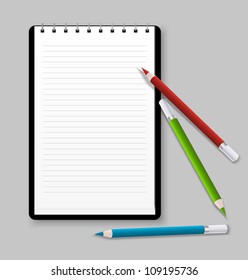 Notebook with three color pencils