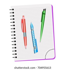 Notebook  and three pens on a white background
