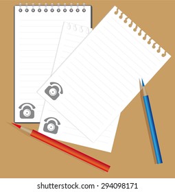 notebook, torn pieces of paper and colored pencils