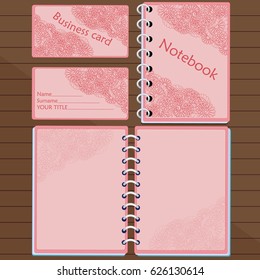 Notepad and business card on the table