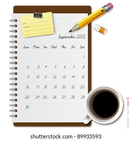 Notepad calendar 2012 september with coffee and pencil