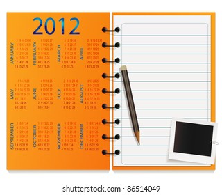 Notepad with calendar on cover, pencil and photo card