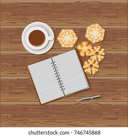 Notepad, coffee and Christmas gingerbread. Wooden background. Wooden background. Christmas holidays. New Year. View from above. Design for a banner, poster, printing on fabric or paper.