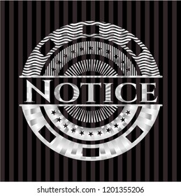 Notice silvery badge