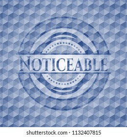Noticeable blue emblem with geometric background.