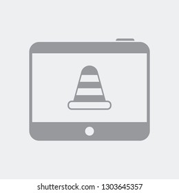 Notification message with traffic cone on the screen of a tablet as a symbol of error or warning of work in progress