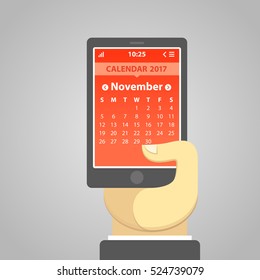 November 2017, weeks start from Sunday. Vector illustration of a smartphone holding in a hand, with a calendar on the screen. Simple user interface in flat design.