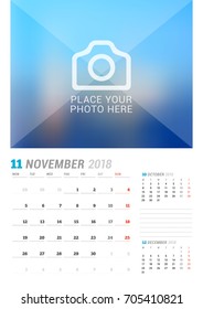 November 2018. Wall calendar planner template. Vector design print template with place for photo. Week starts on Monday. 3 Months on page