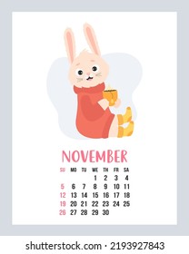 November 2023 calendar. Cute cozy rabbit in sweater and knitted socks with cup of hot tea. Vector illustration. Vertical Template. Week from sunday In English. 2023 year bunny