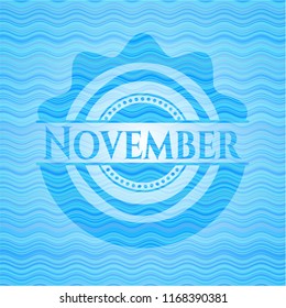 November sky blue water wave emblem.