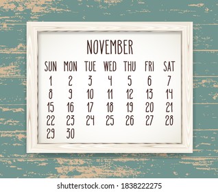 November year 2020 vector monthly calendar. Hand drawn text in a wooden frame over teal rustic distressed wood background. Week starting from Sunday.