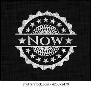 Now chalk emblem written on a blackboard