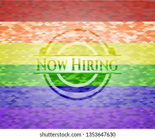 Now Hiring on mosaic background with the colors of the LGBT flag