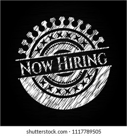 Now Hiring written on a chalkboard