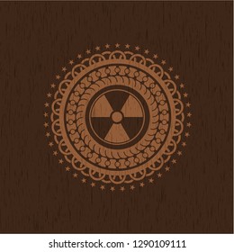 nuclear, radioactive icon inside badge with wooden background