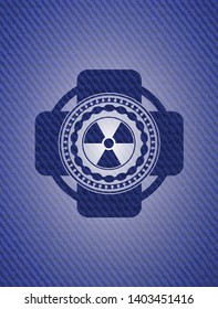 nuclear, radioactive icon inside badge with jean texture