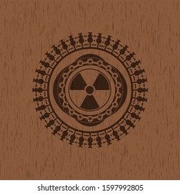 nuclear, radioactive icon inside badge with wooden background