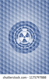 nuclear, radioactive icon inside blue polygonal emblem.