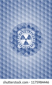 nuclear, radioactive icon inside blue polygonal badge.