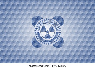 nuclear, radioactive icon inside blue emblem with geometric pattern background.