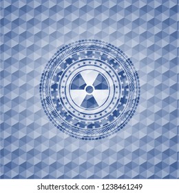 nuclear, radioactive icon inside blue polygonal emblem.