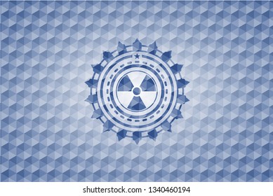 nuclear, radioactive icon inside blue badge with geometric pattern background.
