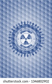nuclear, radioactive icon inside blue badge with geometric background.