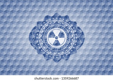 nuclear, radioactive icon inside blue emblem or badge with abstract geometric pattern background.