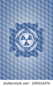 nuclear, radioactive icon inside blue polygonal emblem.
