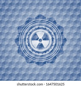 nuclear, radioactive icon inside blue polygonal badge.