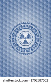 nuclear, radioactive icon inside blue hexagon badge. 