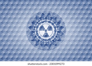 nuclear, radioactive icon inside blue emblem or badge with geometric pattern background. 