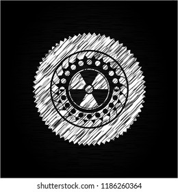 nuclear, radioactive icon inside chalk emblem
