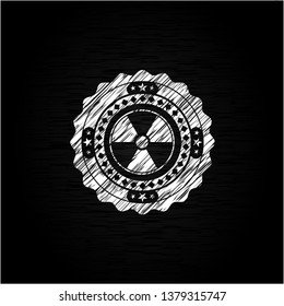 nuclear, radioactive icon inside chalk emblem