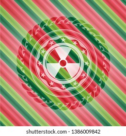 nuclear, radioactive icon inside christmas colors emblem.