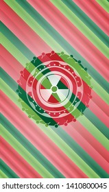 nuclear, radioactive icon inside christmas colors style badge.