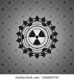 nuclear, radioactive icon inside dark badge or emblem