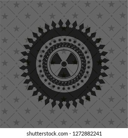 nuclear, radioactive icon inside dark badge