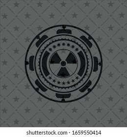nuclear, radioactive icon inside dark badge or emblem