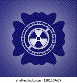 nuclear, radioactive icon inside denim background