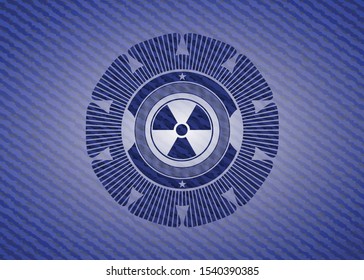 nuclear, radioactive icon inside denim background