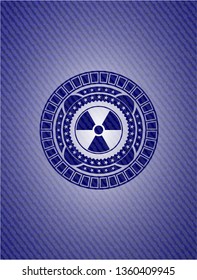 nuclear, radioactive icon inside emblem with jean background