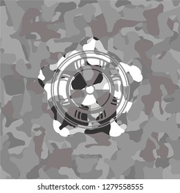 nuclear, radioactive icon inside grey camo emblem