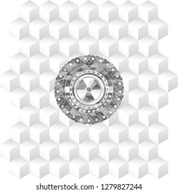 nuclear, radioactive icon inside grey emblem with geometric cube white background